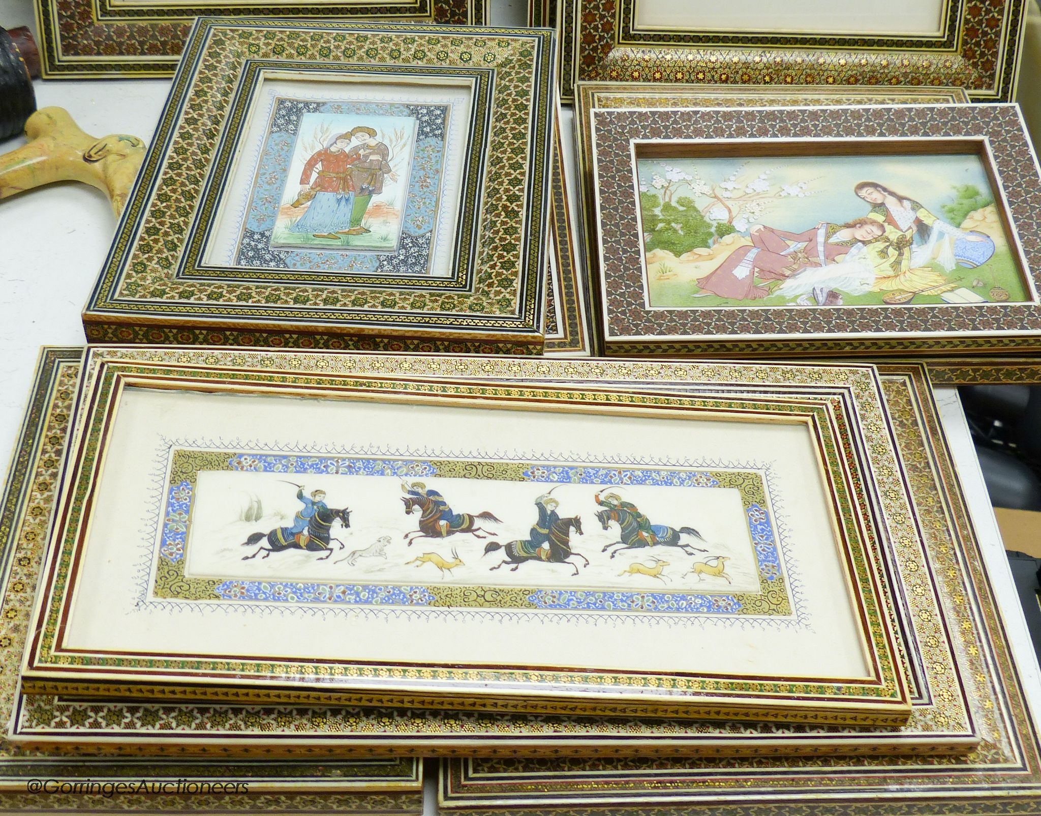 Eleven Persian hand-painted miniatures in decorative Khatam frames
